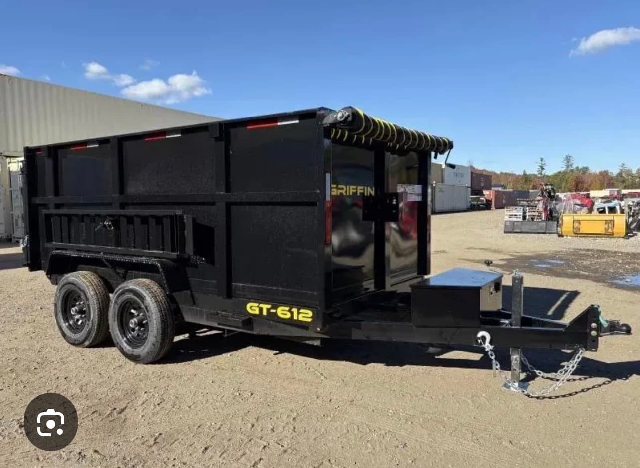 Black Griffin GT-612 dump trailer with high sides, dual axles, and a rolled-up tarp.